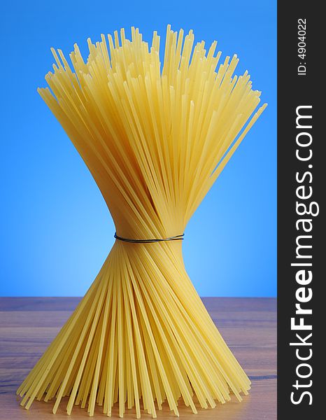 A bundle of spaghetti on white background. A bundle of spaghetti on white background