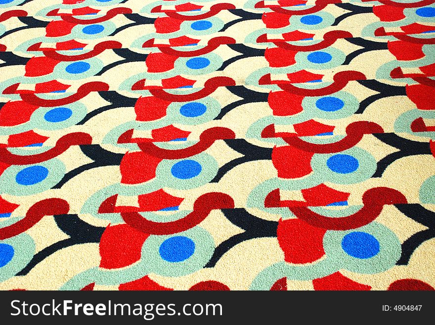 An old felt carpet of colorful patterns. An old felt carpet of colorful patterns.