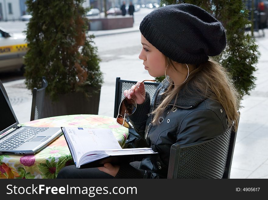 The female student in cafe street in old city. The female student in cafe street in old city