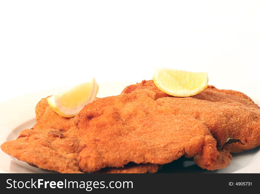 Viennese Schnitzel on a withe background.