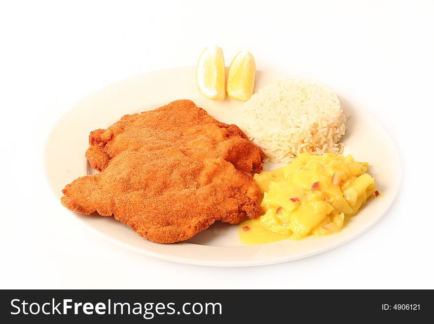 Traditional  viennese Schnitzel with potato salad and rice on a withe background.