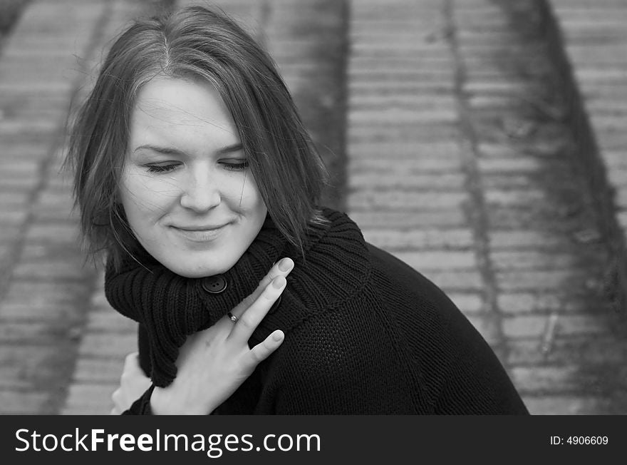 Beautiful woman in black polo neck sweater with closed eyes. Beautiful woman in black polo neck sweater with closed eyes