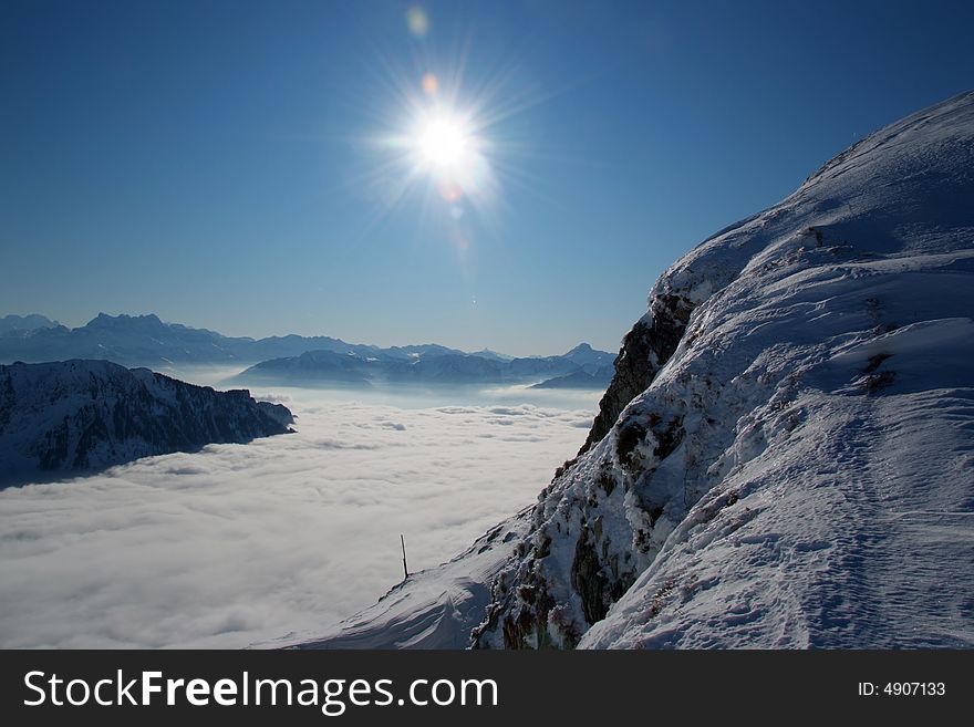 The sun shining over the swiss alps. The sun shining over the swiss alps