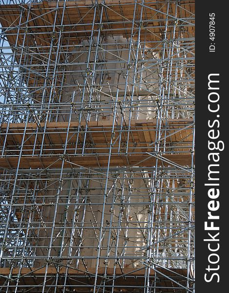 Scaffolding covering a building construction