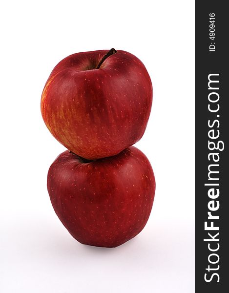 Two stacked red apples