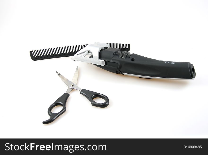 Three isolated tools. Comb, scissors and hairdresser on white background