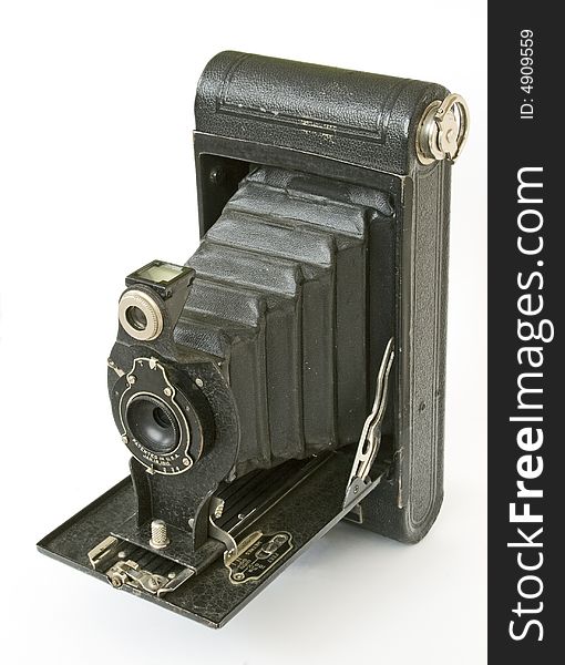 Black vintage folding camera isolated at white. Black vintage folding camera isolated at white