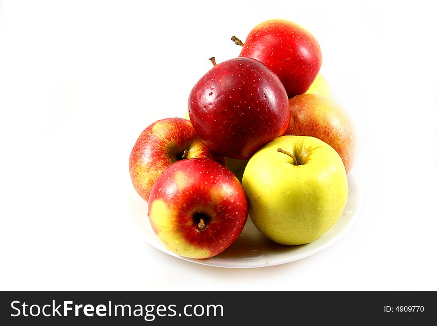 Some apples in red green and yellow as light snack. Some apples in red green and yellow as light snack