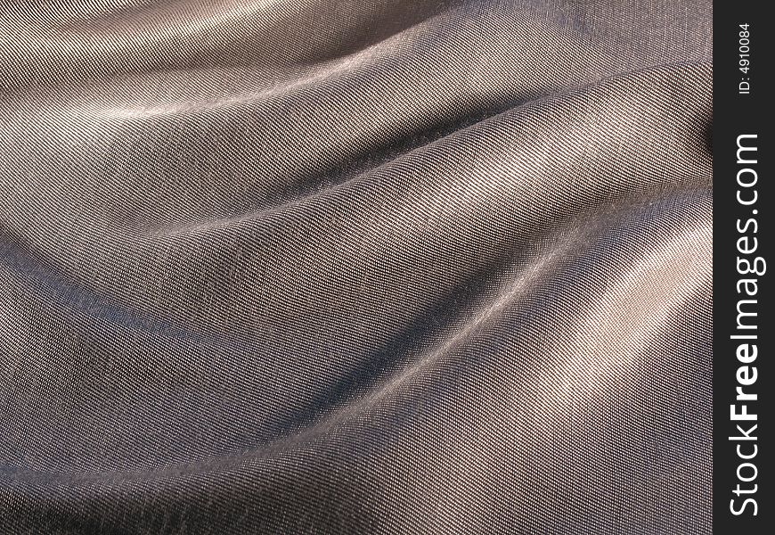 Abstract grey silk background, cloth is bedded by waves. Abstract grey silk background, cloth is bedded by waves