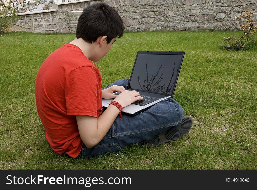 Human hand pressing a key on a laptopkeyboard. Human hand pressing a key on a laptopkeyboard