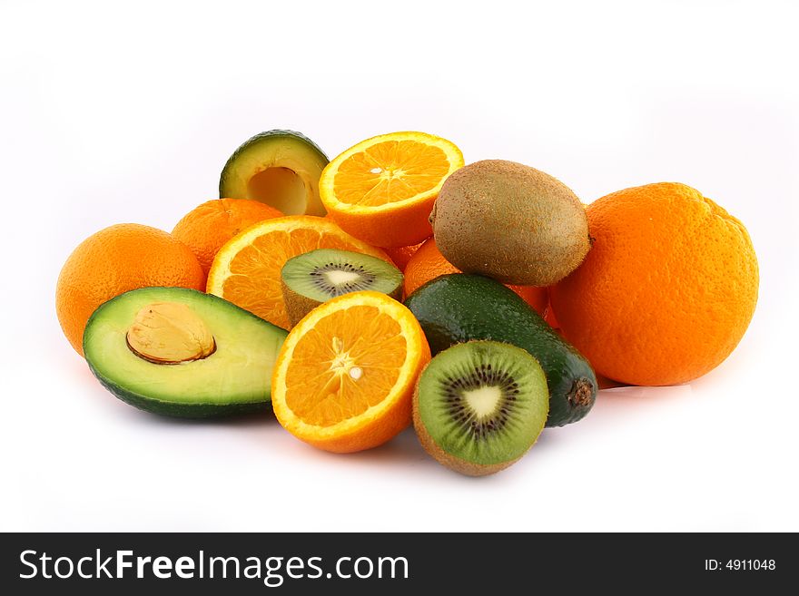 Fresh avocados with other fruits  isolated on white background