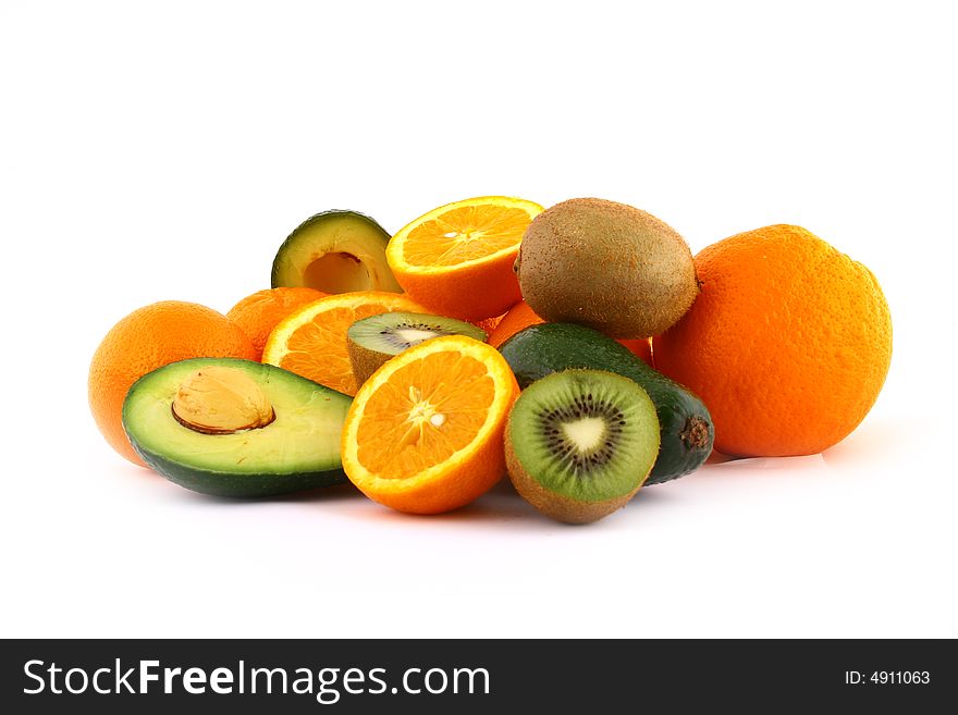 Fresh avocados with other fruits  isolated on white background