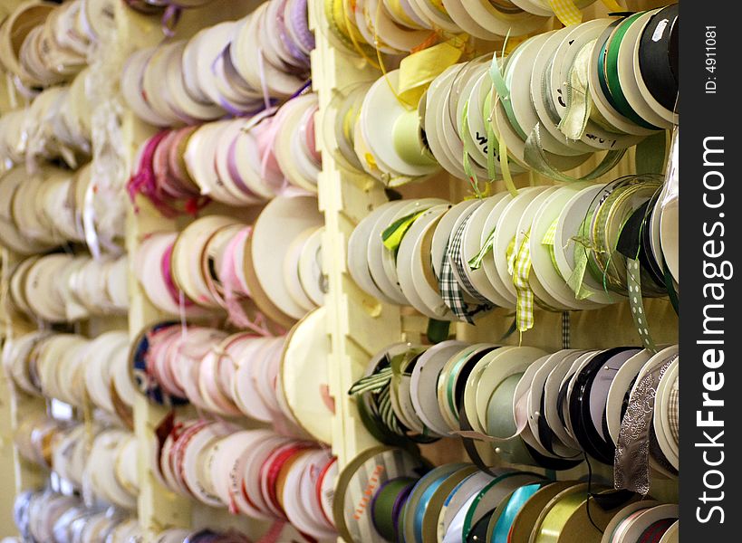 Lots of colourful reels of ribbon in a country shop. Lots of colourful reels of ribbon in a country shop