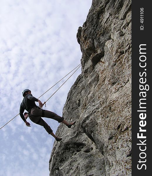 A male rock-climber on training