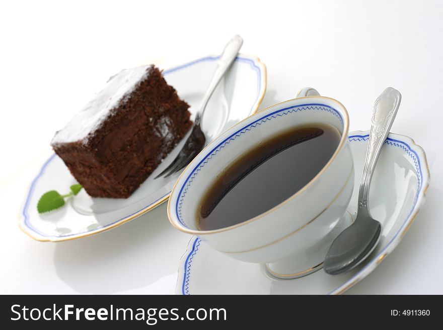 Cup of coffee and chocolate cake