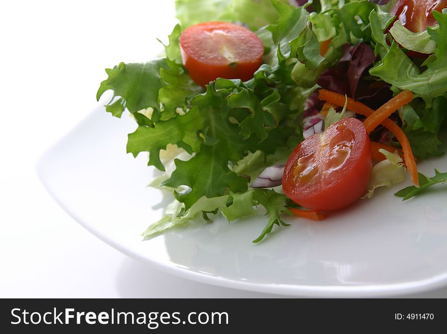 Healthy salad with lettuce, carrots, tomato