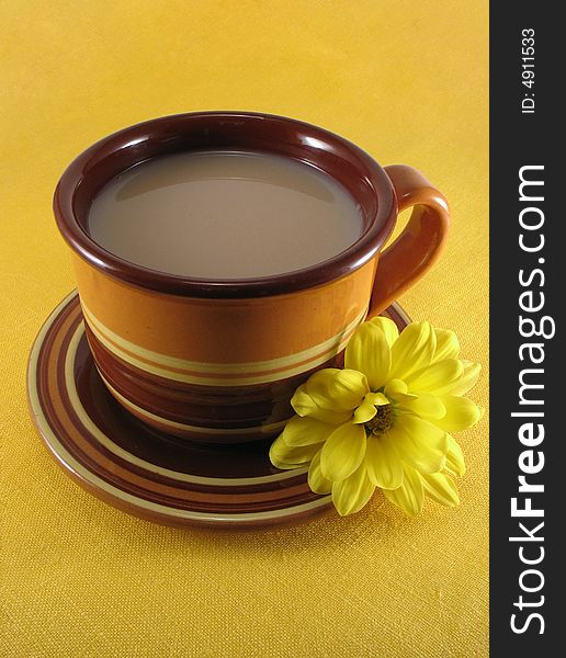 Ceramic cup of tea on the yellow napkin. Ceramic cup of tea on the yellow napkin