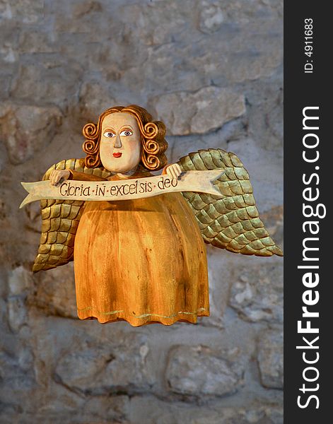 Decorative orange angel made from wood