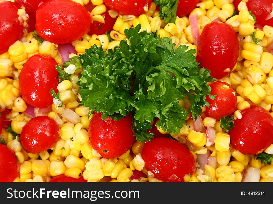 Grilled Corn Salad background. Tomato, corn, parsley, onion.