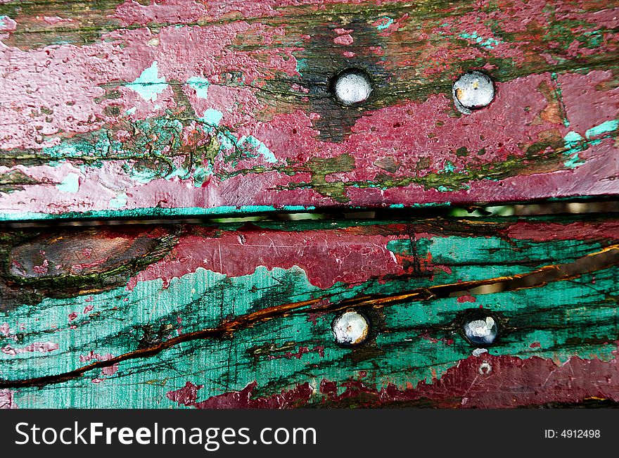 Colourful detail of a old grungy bench. Colourful detail of a old grungy bench