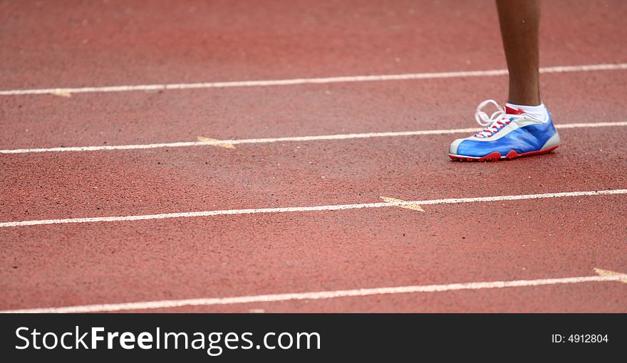 Single foot of a runner during a race. Single foot of a runner during a race