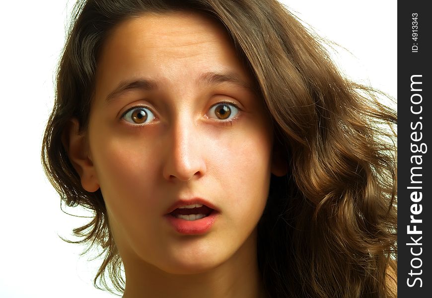 A pretty lady with sidelong brown hair is surprised and her mouth is opened