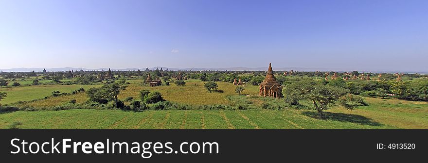 Myanmar, Bagan: general panorama; blue sky and ancient pagodas in the middle of the fields
