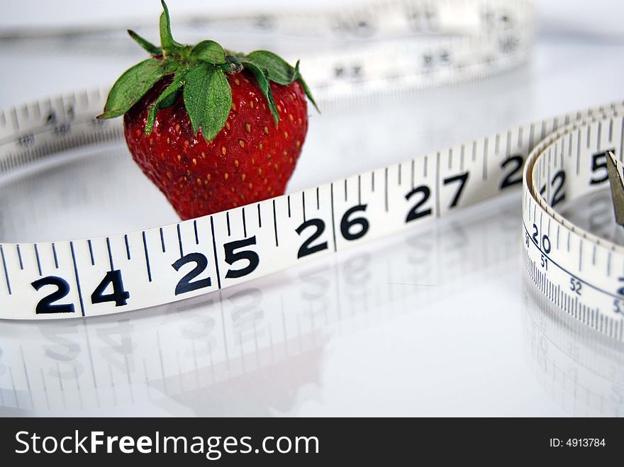Ripe strawberry with a tape measure. Ripe strawberry with a tape measure.