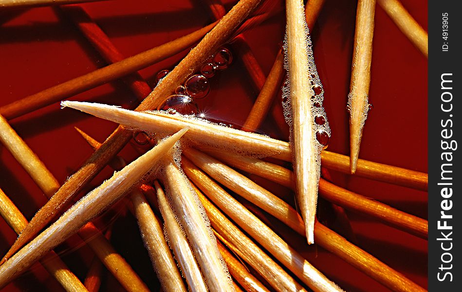 An abstract close-up photograph of pointy toothpicks. Suggests chaos.