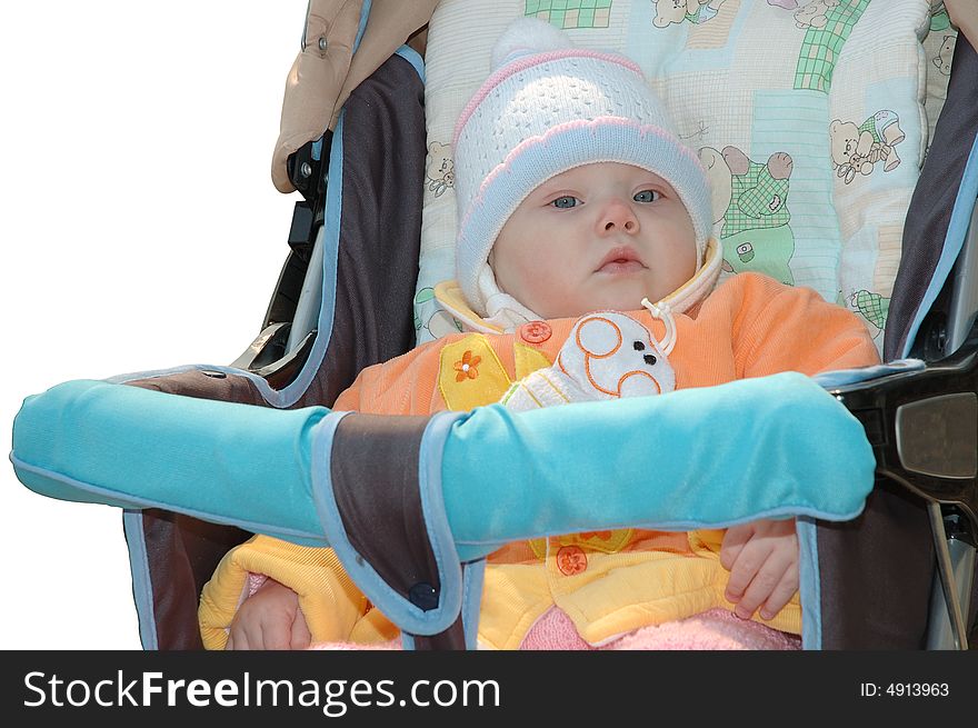 Little girl in bright clothes sit in carriage. Little girl in bright clothes sit in carriage.