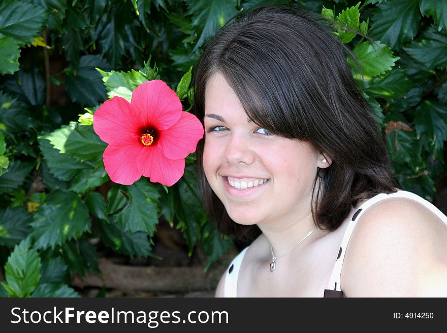 Young Woman With Hibiscus Flower