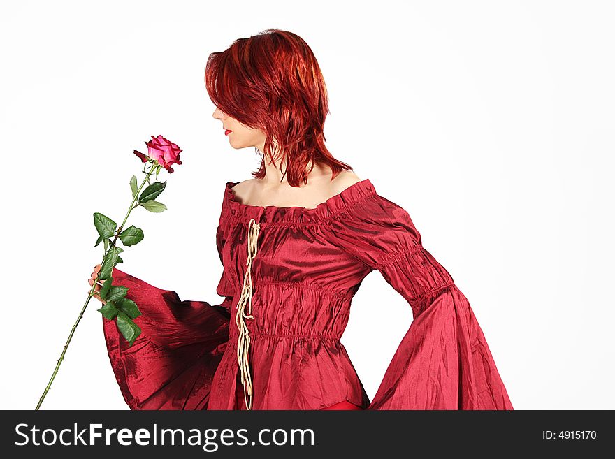 Cute redhead girl with red rose