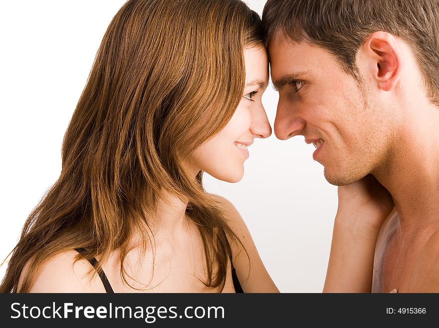 Young adult couple in the studio kissing. Young adult couple in the studio kissing