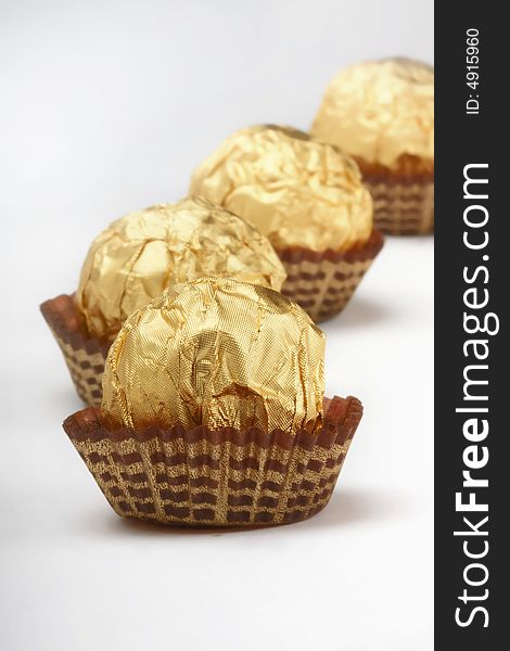 Chocolate truffles foil wrap gold. Chocolate truffles foil wrap gold