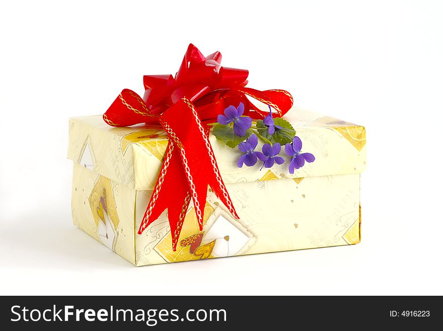 Holiday box with the tape and the blue flowers