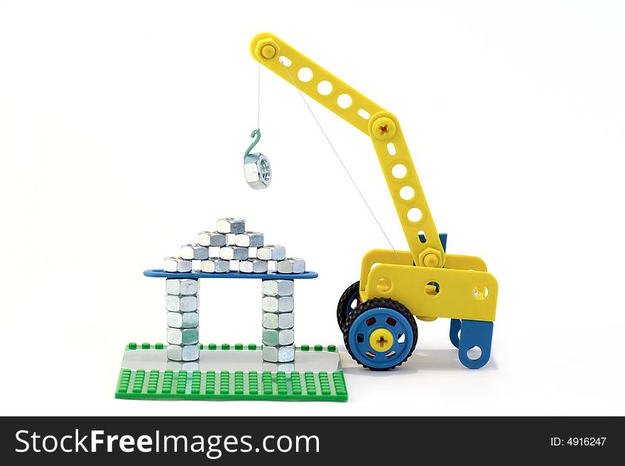 The mock-up of house and crane, depict building, against the white background. The mock-up of house and crane, depict building, against the white background