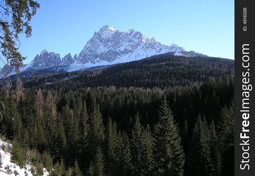 Alpine mountains and forest in winter in Sesto, Italy