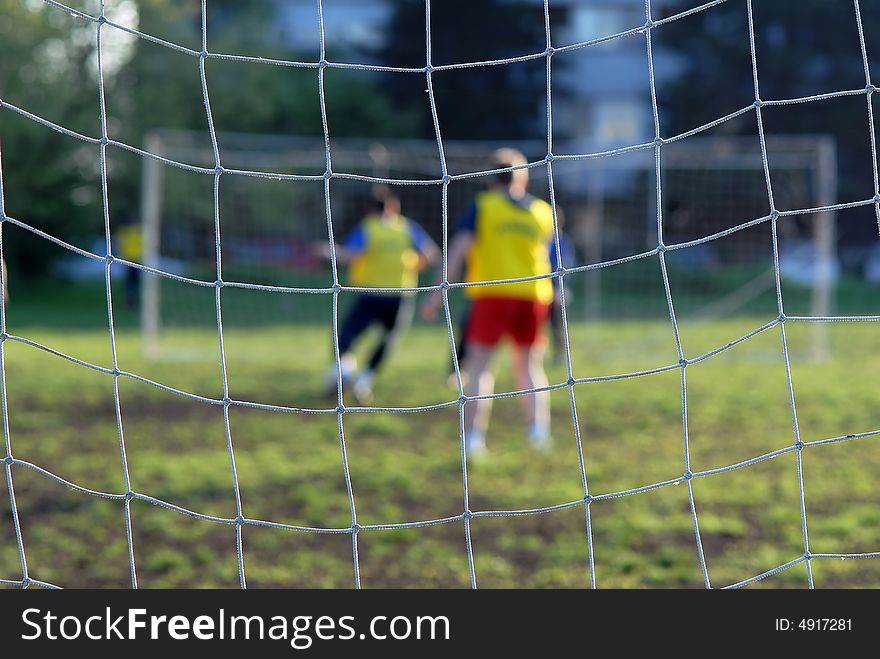 Soccer Players In Front Of Net