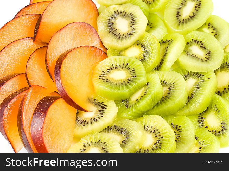 Background from sliced kiwi and plums. Background from sliced kiwi and plums.