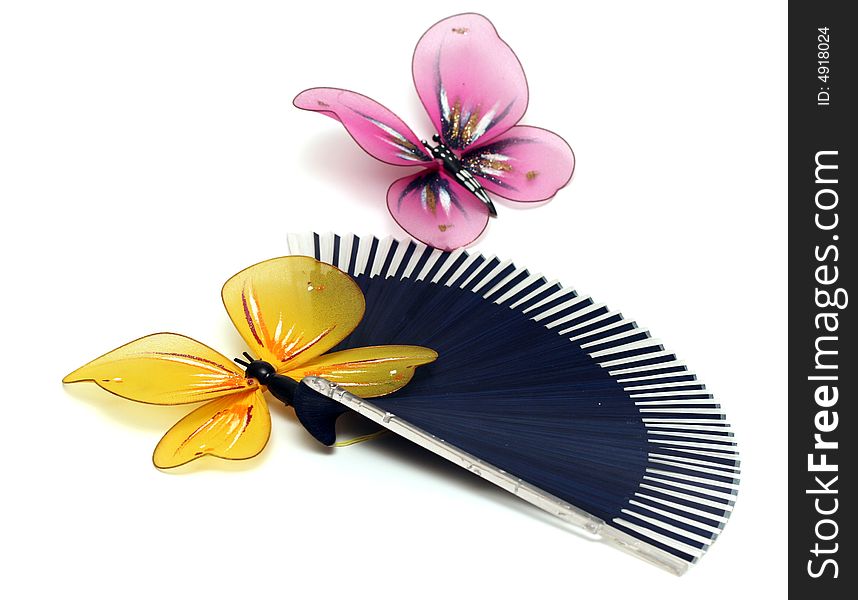 The artificial, plastic butterfly on a fan