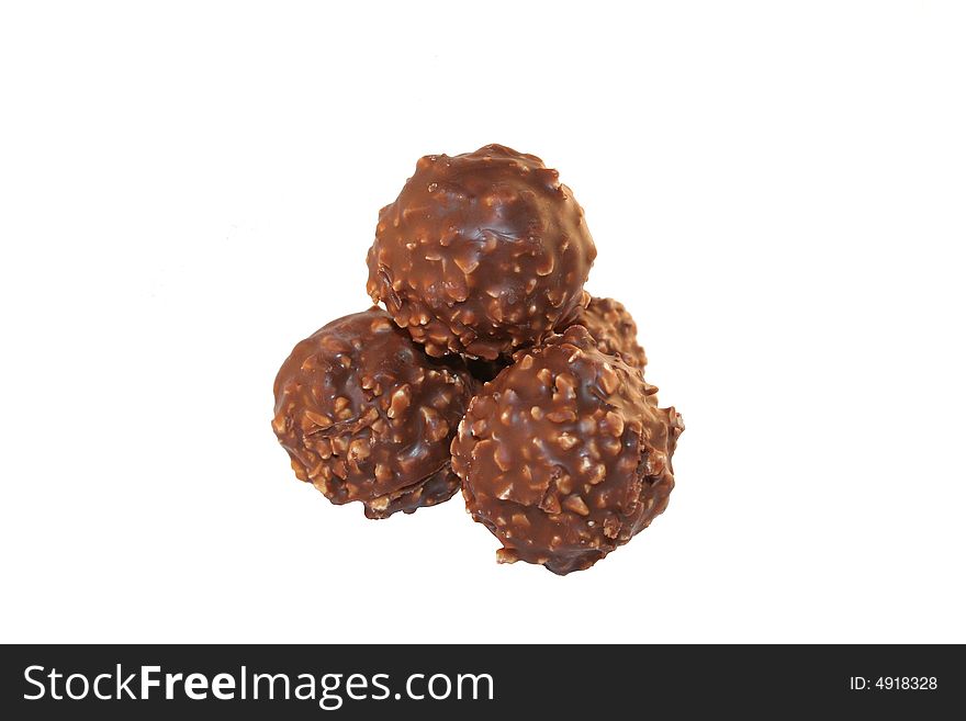 Four chocolates isolated over white