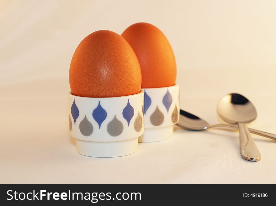 Two eggs in eggcups isolated