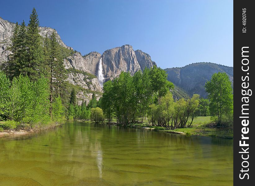 Merced River with Yosemite Falls in background. Merced River with Yosemite Falls in background.