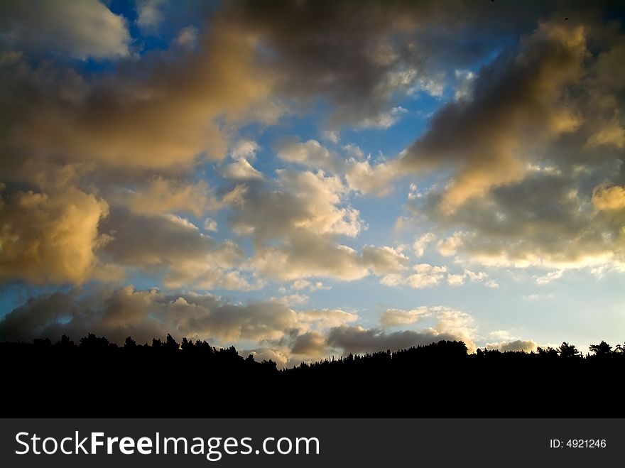 Clouds in sunset and mountain silhouette. Clouds in sunset and mountain silhouette