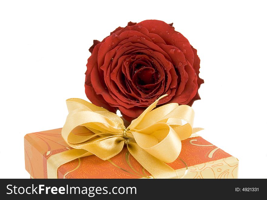 Gift box with ribbon and red rose isolated on white