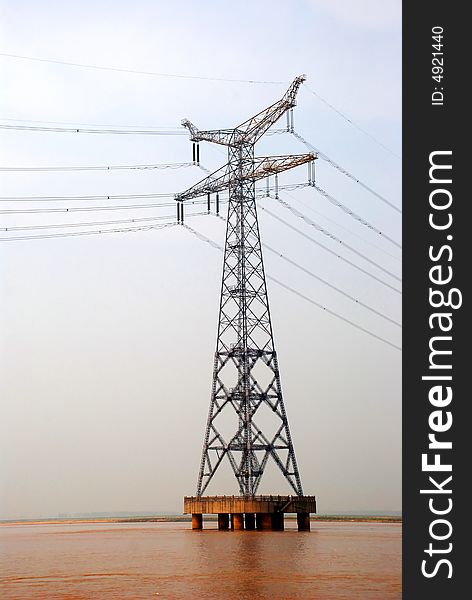 A pylon in the middle of the Yellow River, the muddiest river in the world,Central China. A pylon in the middle of the Yellow River, the muddiest river in the world,Central China.