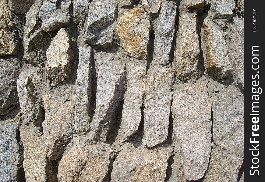 Wall from the stones fastened by cement