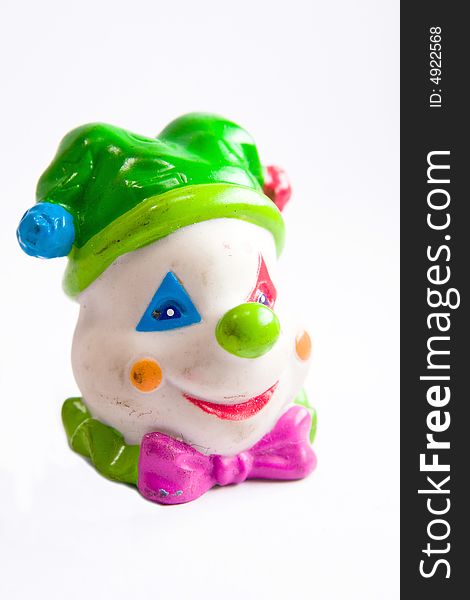 Single colourful clown head toy macro close up. Single colourful clown head toy macro close up