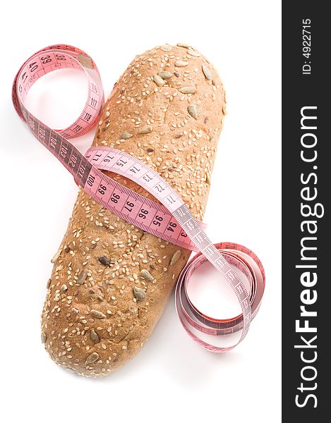 Bread wrapped with a measurement tape on a white background