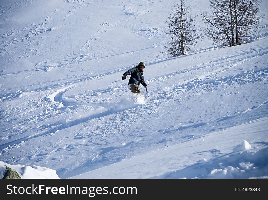 The snowboarder in a mountain (extreme sport). The snowboarder in a mountain (extreme sport)